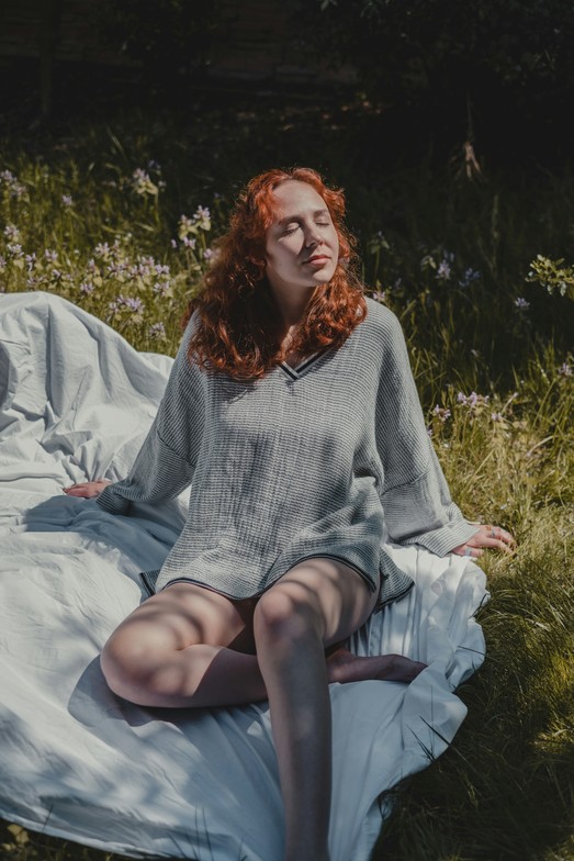 A women relaxing in the sun symbolizing somatic trauma healing