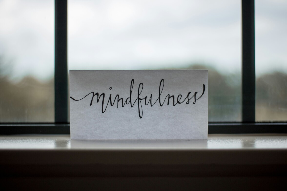 mindfulness printed paper near window representing mindfulness as new years resolution