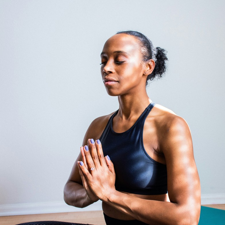women appearing to be meditating representing meditation as new year resolution 
